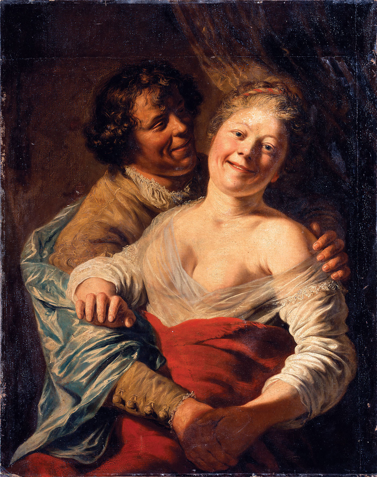 youth embracing a young woman